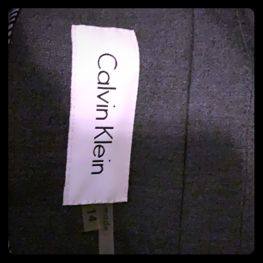 A stylish suit jacket with matching pencil skirt .